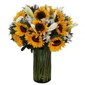 Florero con girasoles y alcatraces